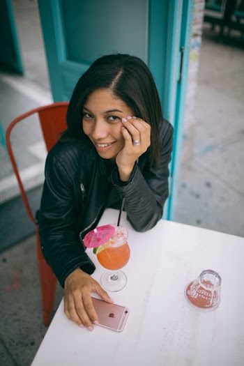 Woman Sitting on Chair With Her Hands Below Her Cheek