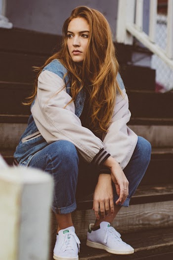 Woman Sitting on Concrete Stairs
