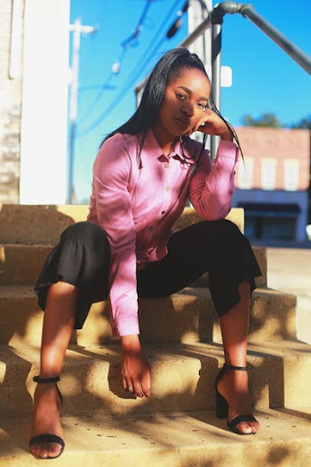 Woman Sitting on Concrete Stairs