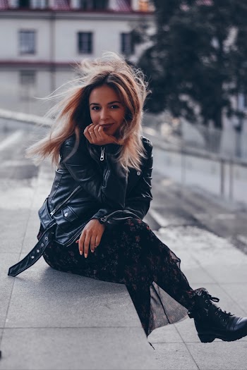 Woman Sitting on Concrete Stairs in Macro Photography