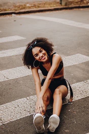 Woman Sitting On Cross Walk