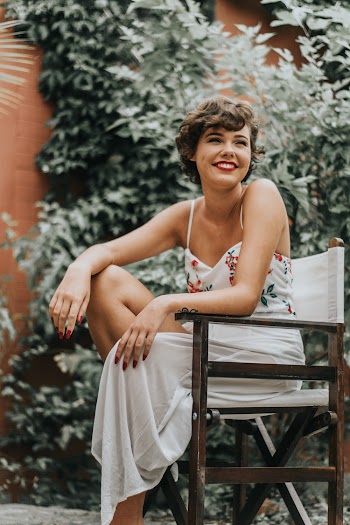 Woman Sitting On Director's Chair