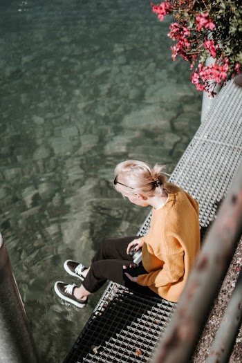 Woman Sitting on Dock