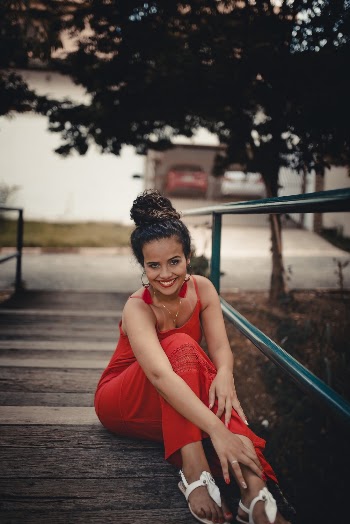 Woman Sitting on Dock Near Tree