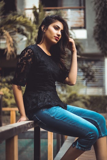 Woman Sitting on Fence