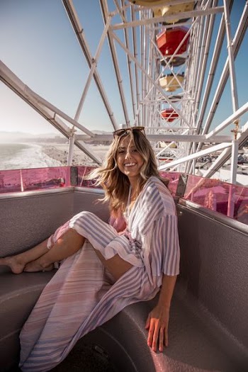 woman sitting on Ferris wheel
