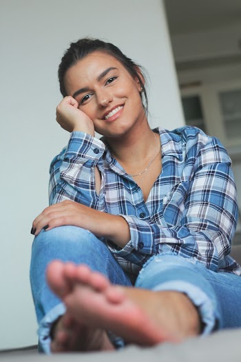 Woman Sitting on Floor Inside Room