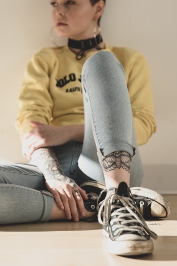 Woman Sitting on Floor Wearing Yellow Sweater
