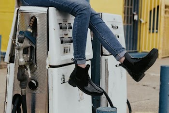 woman sitting on fuel tank