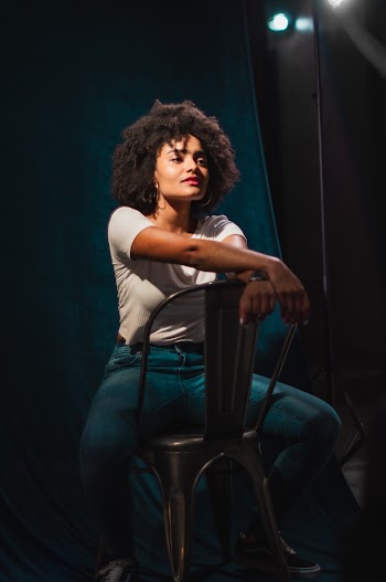 Woman Sitting on Gray Chair