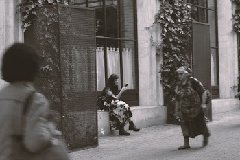 Woman Sitting on Gray Concrete Front Step of House