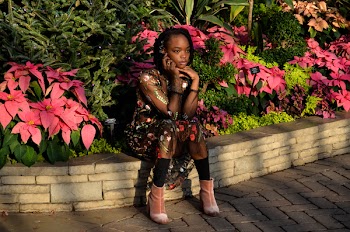 Woman Sitting on Gray Concrete Slabs