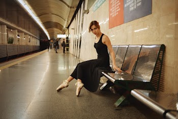 Woman Sitting on Gray Gang Chair