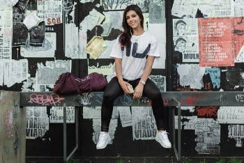 Woman Sitting on Gray Metal Railings