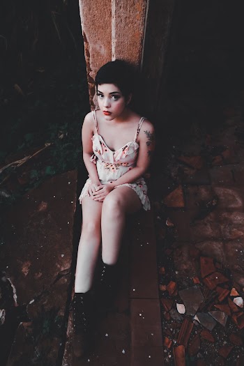 Woman Sitting on Ground
