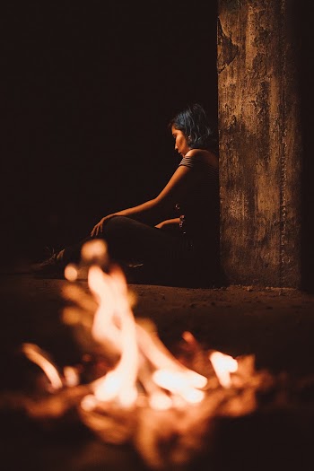 Woman Sitting on Ground