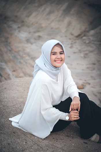 Woman Sitting on Ground