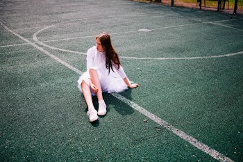 Woman Sitting on Ground