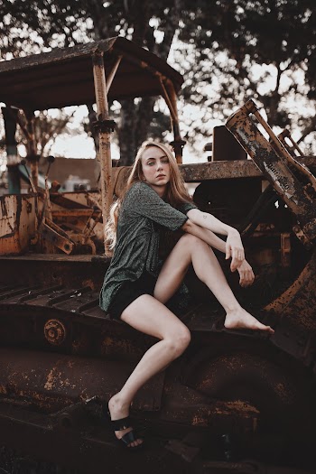 Woman Sitting on Heavy Equipment