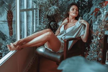 Woman Sitting on Leather Padded Armchair