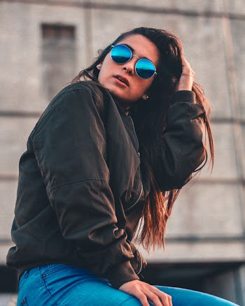 Woman Sitting on Ledge
