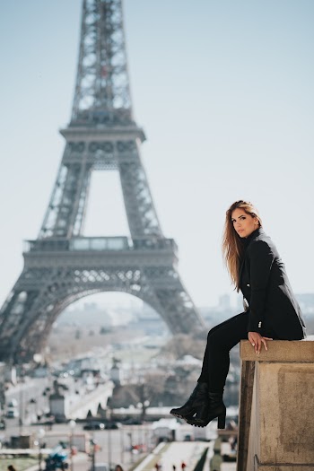 Woman Sitting on Ledge