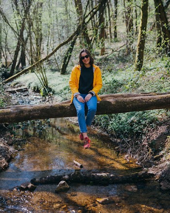 Woman Sitting On Log