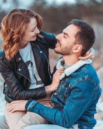 Woman Sitting On Man's Lap