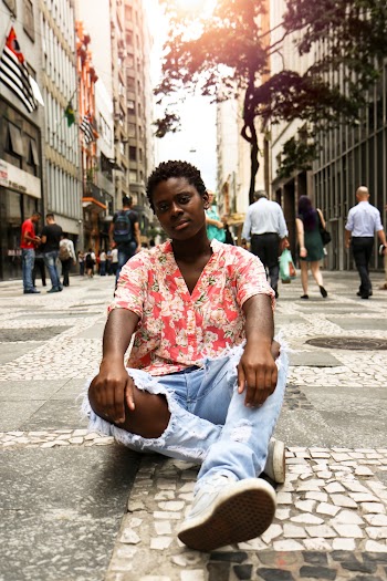 Woman Sitting on Marble Tile Road