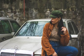 Woman Sitting On Mercedes Benz Sedan 
