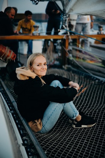 Woman Sitting on Metal Net