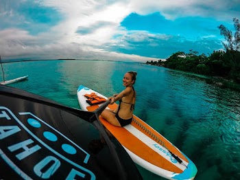 Woman Sitting on Paddle Board