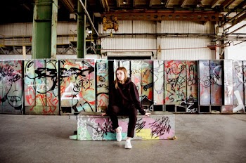 Woman Sitting on Painted bench