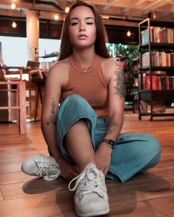 Woman Sitting On Parquet Flooring