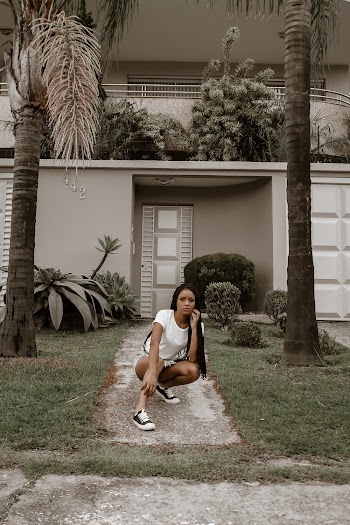 Woman Sitting on Pathway