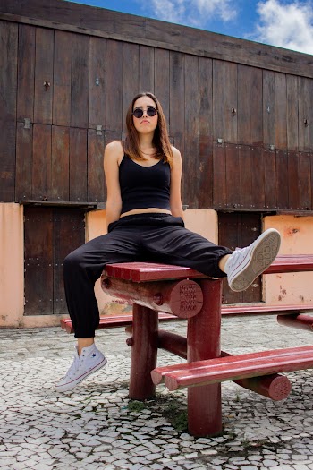 Woman Sitting on Picnic Table