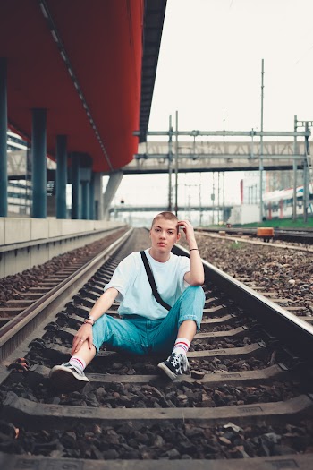 Woman Sitting on Railway