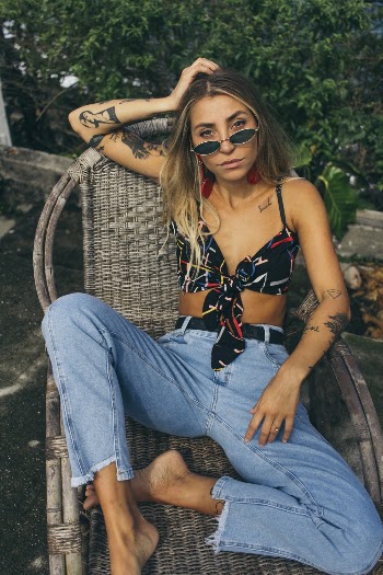 Woman Sitting on Rattan Chair