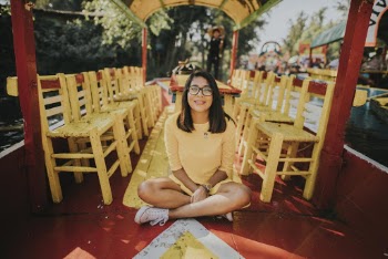 Woman Sitting on Red Floor
