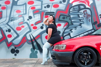 Woman Sitting On Red Vehicle