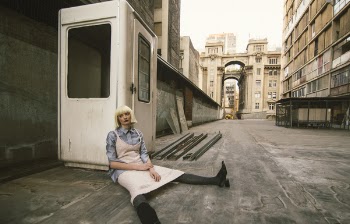 Woman Sitting on Road