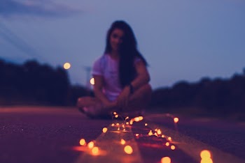 Woman Sitting on Road