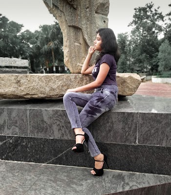 Woman Sitting on Rock