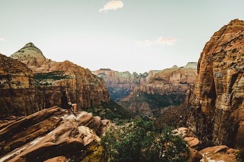 woman sitting on rock