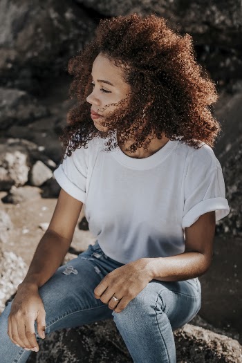 Woman Sitting on Rock
