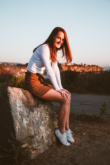 Woman Sitting on Rock