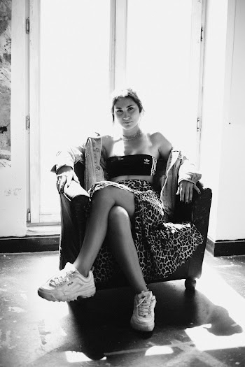Woman Sitting on Seat Near Window