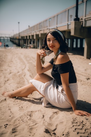 Woman Sitting on Shore