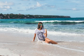 Woman Sitting On Shore