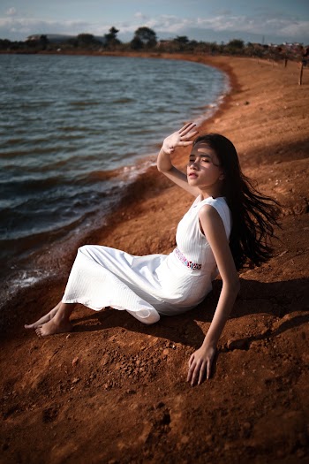 Woman Sitting on Shore